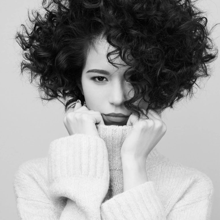 Studio,Fashion,Portrait,Of,Beautiful,Asian,Woman,In,White,Pullover